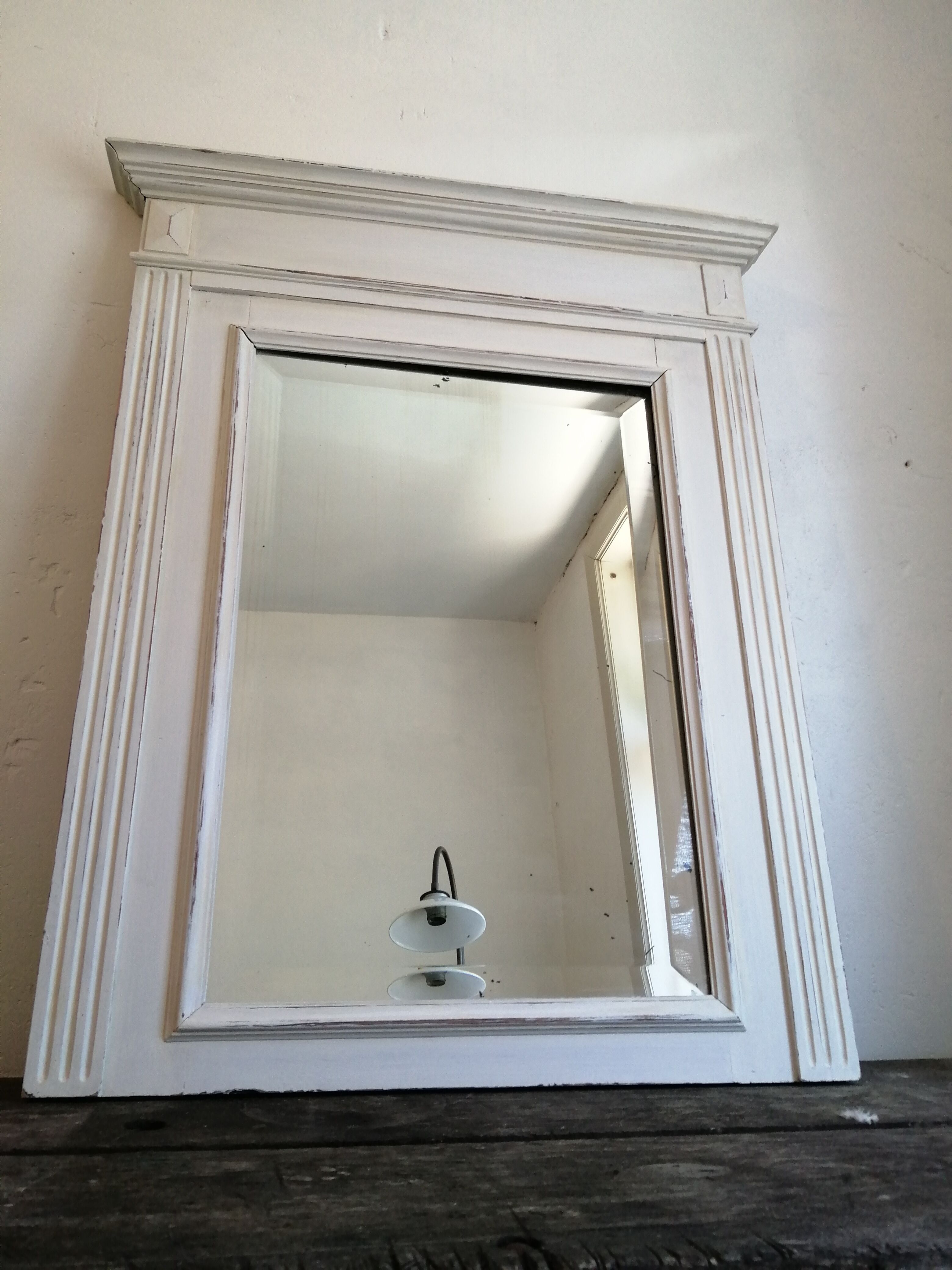 Beveled fireplace mirror