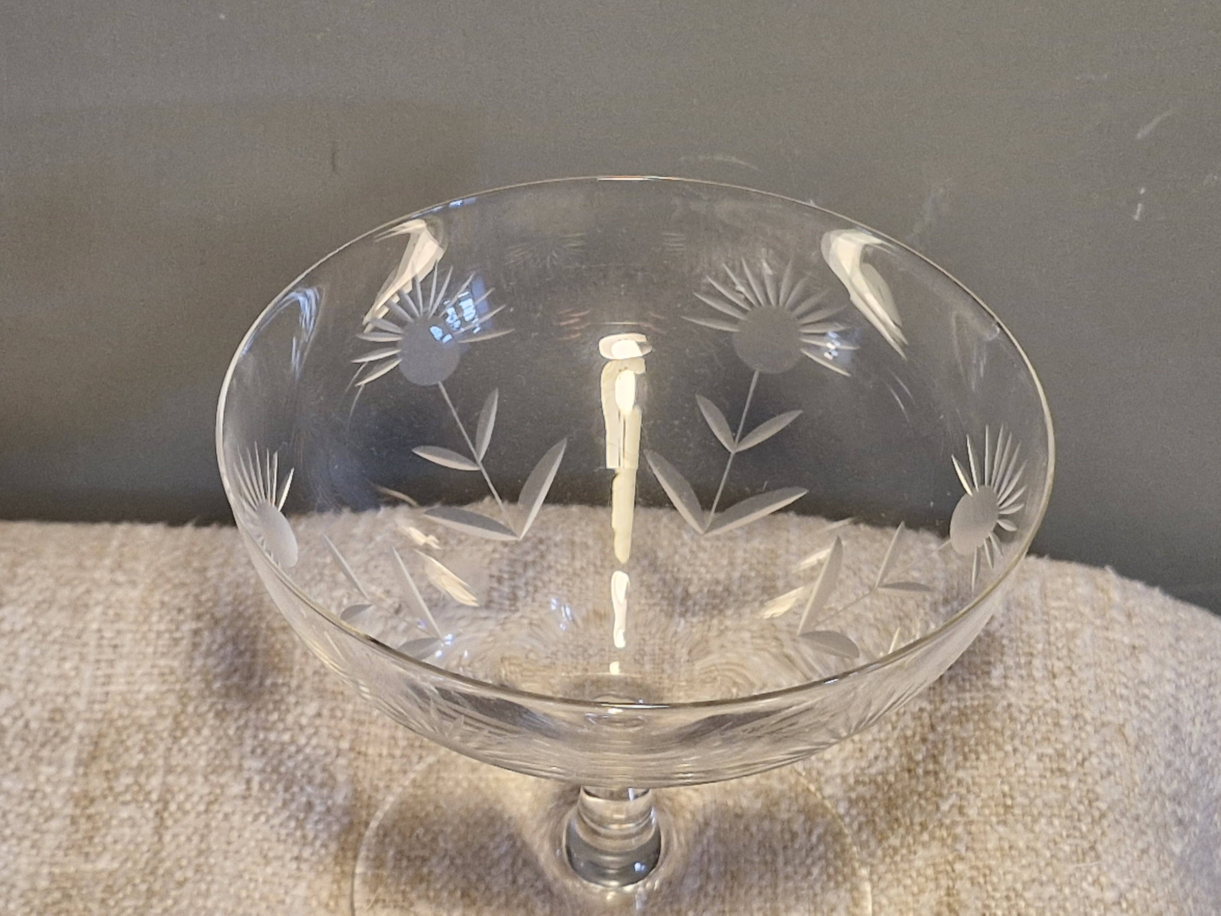 3 antique champagne coupes in engraved crystal with large daisies.
