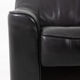Maison De Sede. Armchair and its ottoman in black leather. 1970s.