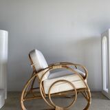 Large rattan rest chair and white cushions
