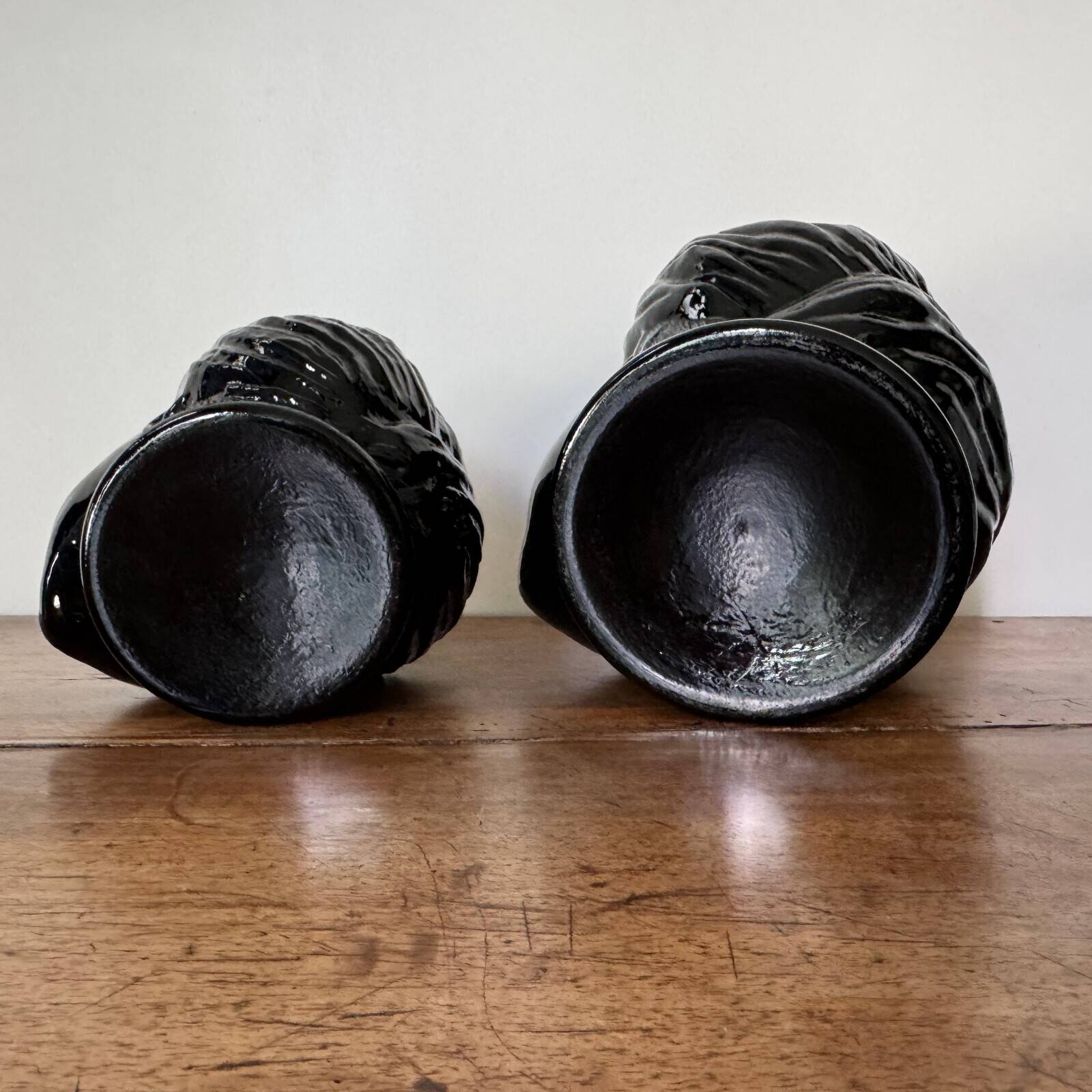 2 glass heads representing Moors