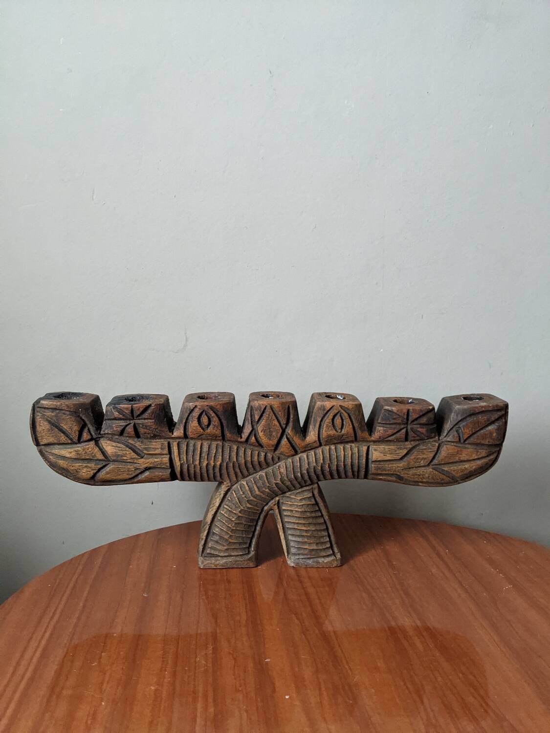 Hand-carved wooden candle holder, ethnic tribal style.