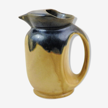 Vintage art deco water pitcher with drippy dark blue glaze.