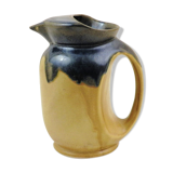 Vintage art deco water pitcher with drippy dark blue glaze.