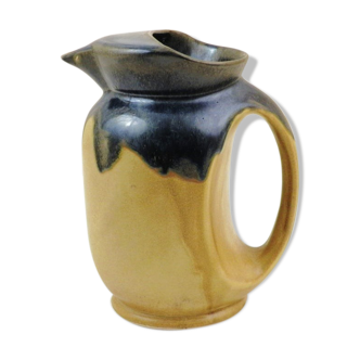 Vintage art deco water pitcher with drippy dark blue glaze.