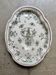 Oval Moustiers plate in cream and green earthenware, 18th century.