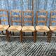 8 antique Vendée straw chairs in solid cherry wood.