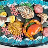 Dish with fish and shells relief decoration