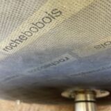 Curl armchair in red leather by Roche Bobois