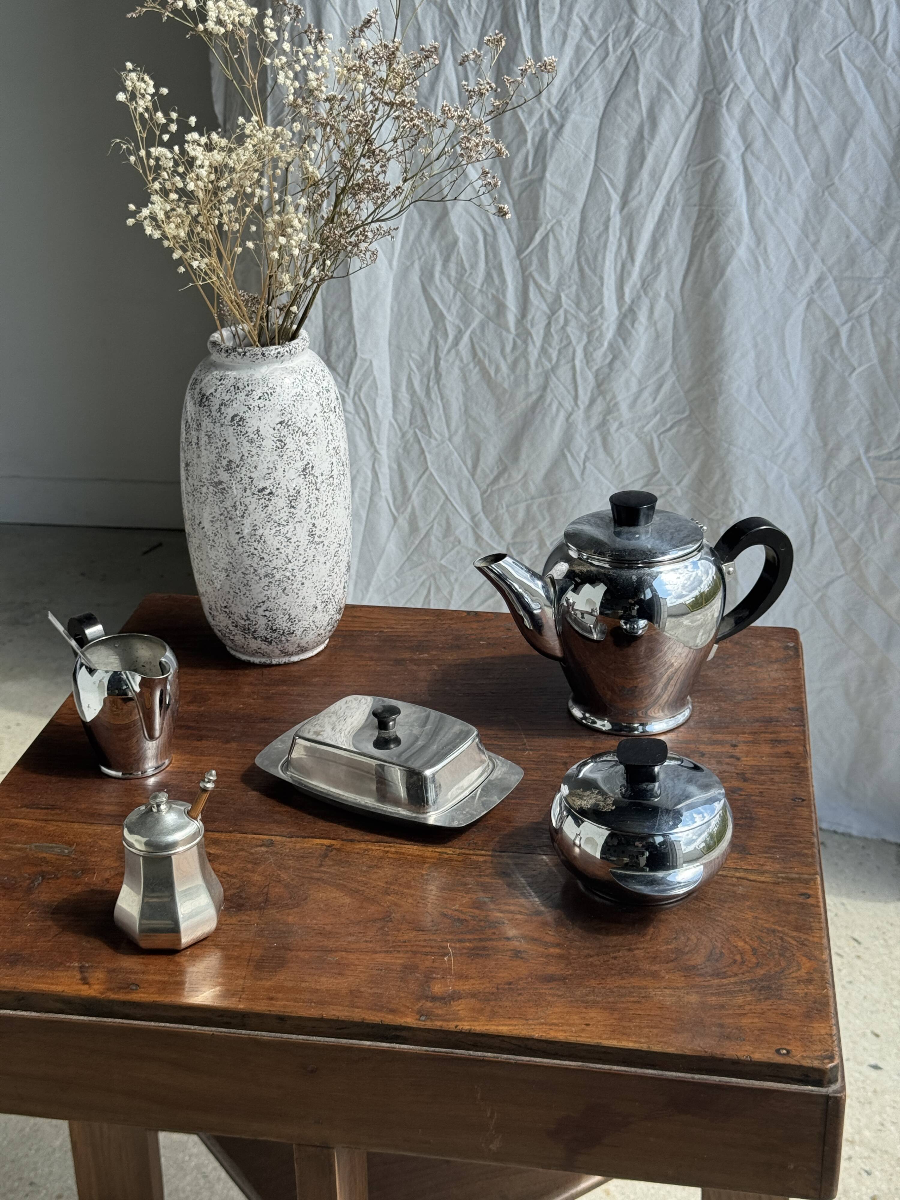 Tea set including teapot, milk jug, sugar bowl and butter dish