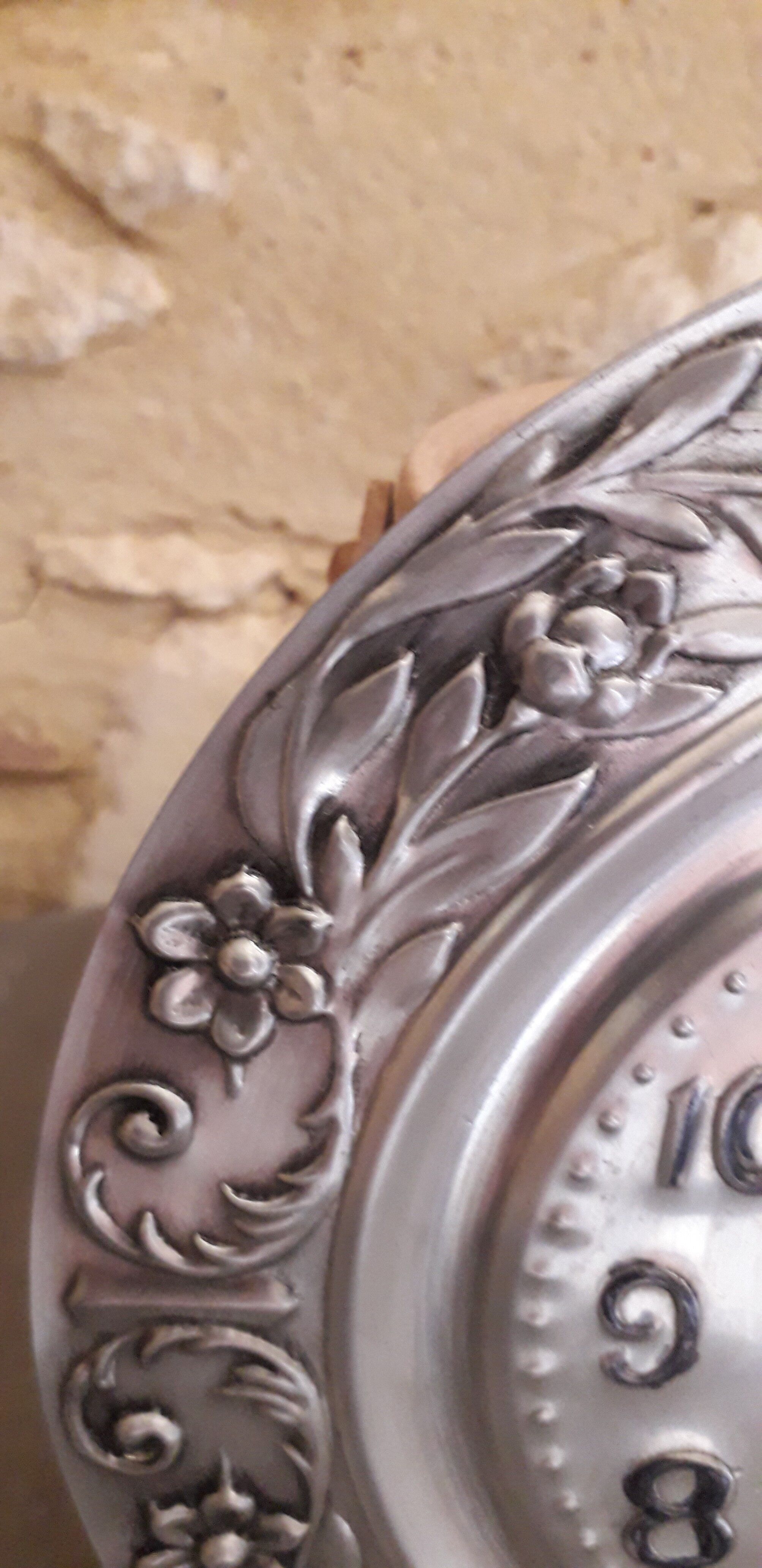 Repelled pewter wall clock floral decoration