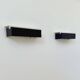Pair of vintage wall sconces, painted black and white metal, Sweden 1970.