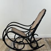 Rocking chair in blackened curved wood and cane, 1900s