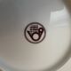 12 plates and 1 serving dish, white porcelain with apple blossom patterns.