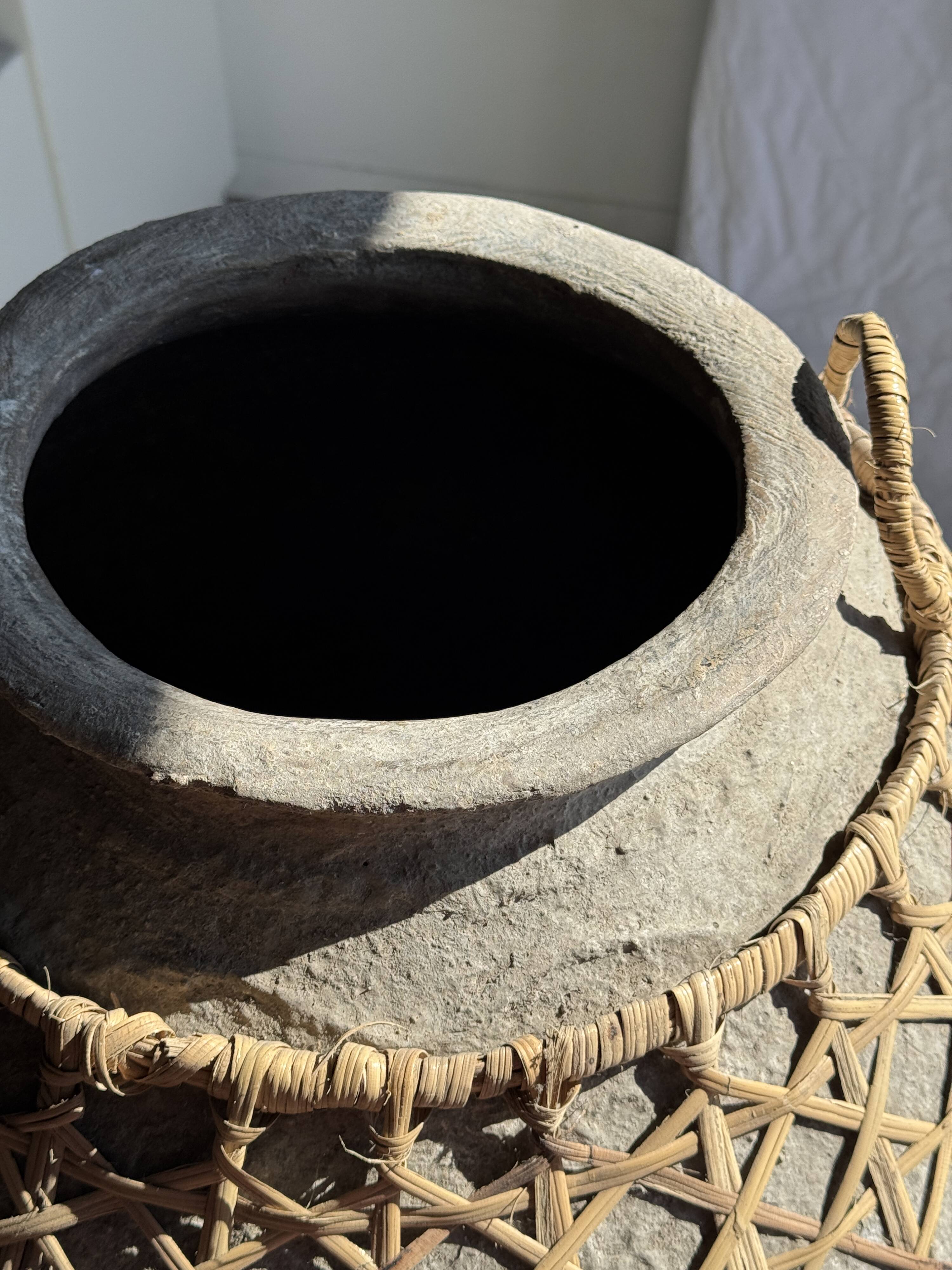 Immense light grey antique-style pot with a crosshatch lid and handles.