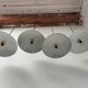 Suspensions in enamelled sheets