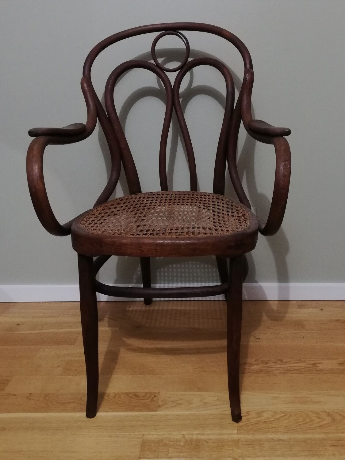 Canned armchair in curved wood signed J.Kohn