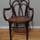 Canned armchair in curved wood signed J.Kohn