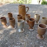 Service mazagrans and decanter in enamelled stoneware.