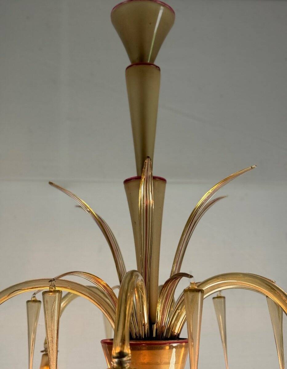 Venetian chandelier in beige/gray murano glass bordered with a red net
