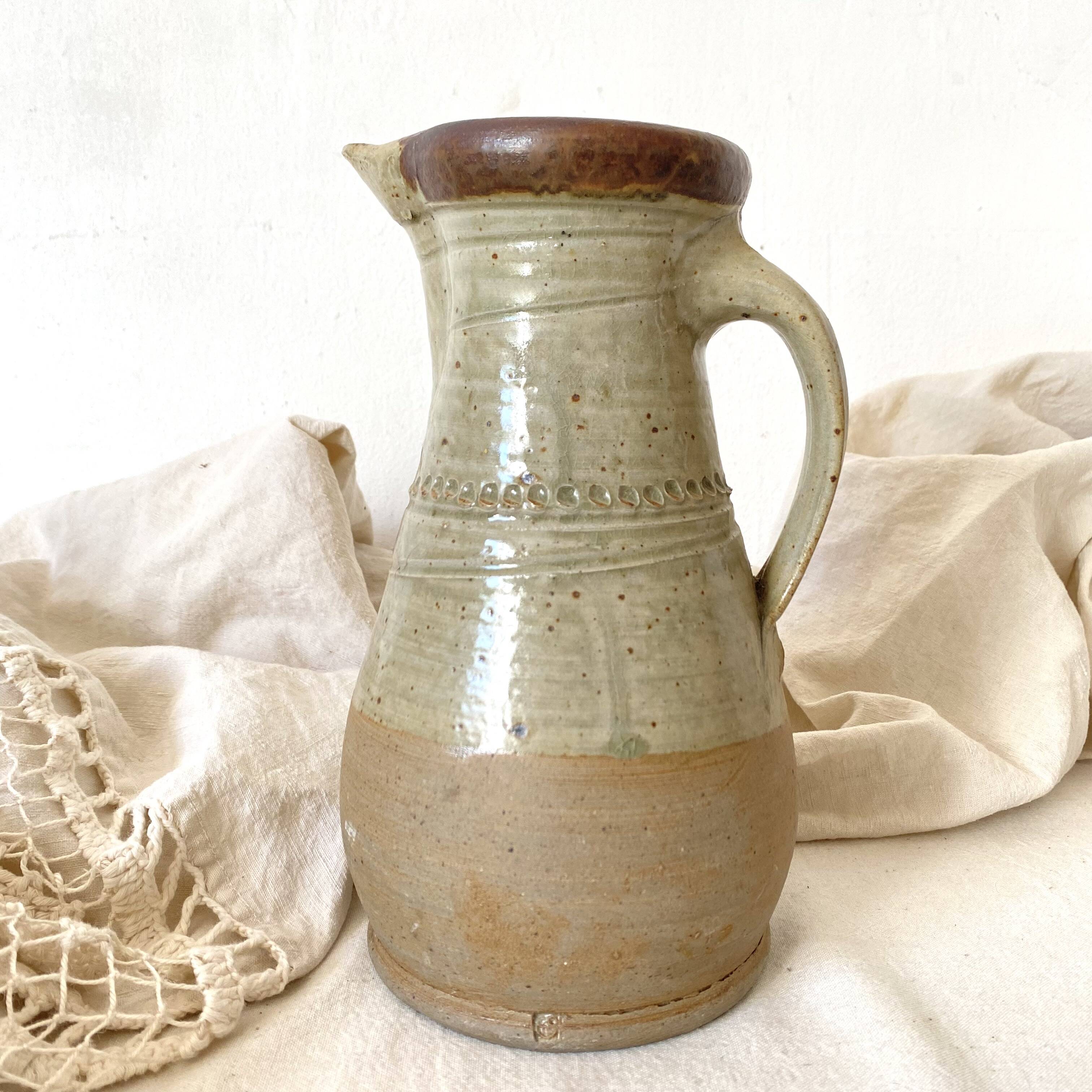 Vintage handcrafted terracotta pitcher