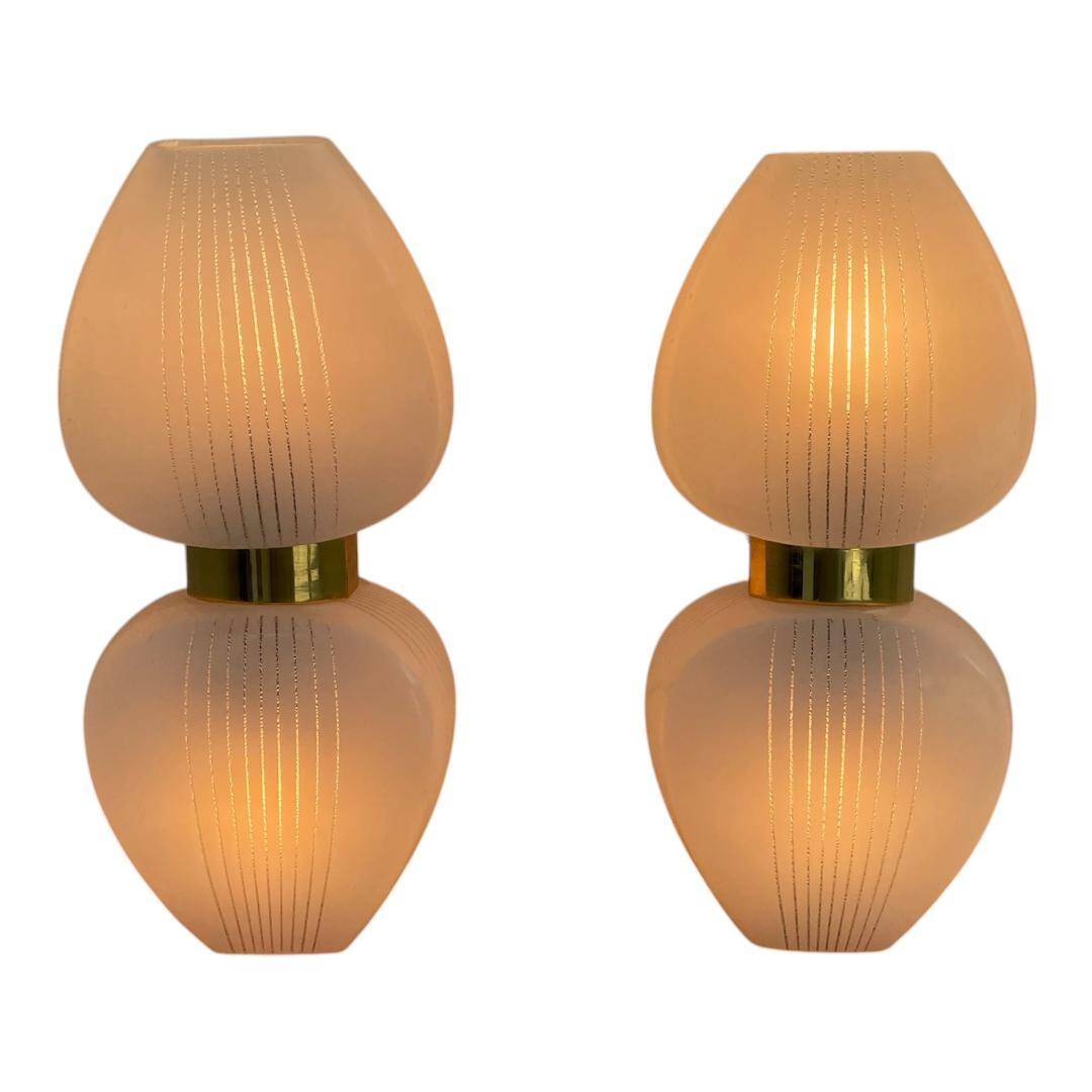 Pair of vintage wall lights from the 60s-70s in striped opaline glass and gilded brass.