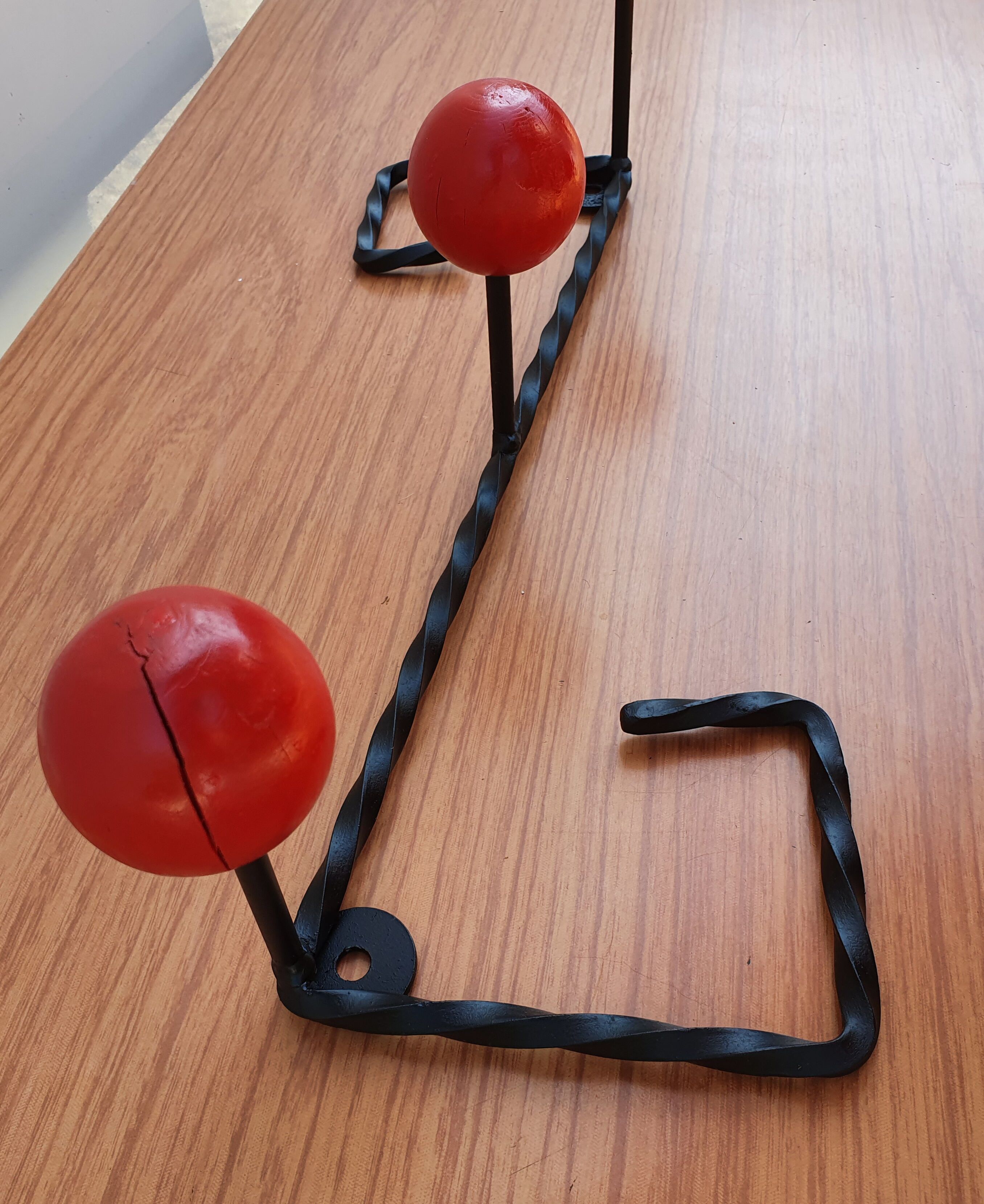 Coat rack wrought iron and red wooden balls