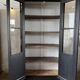 Aged patinated black display cabinet