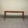 Console from the 1950s with a pink marble top and a cherry wood frame.