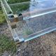 Coffee table in plexiglass and brass.