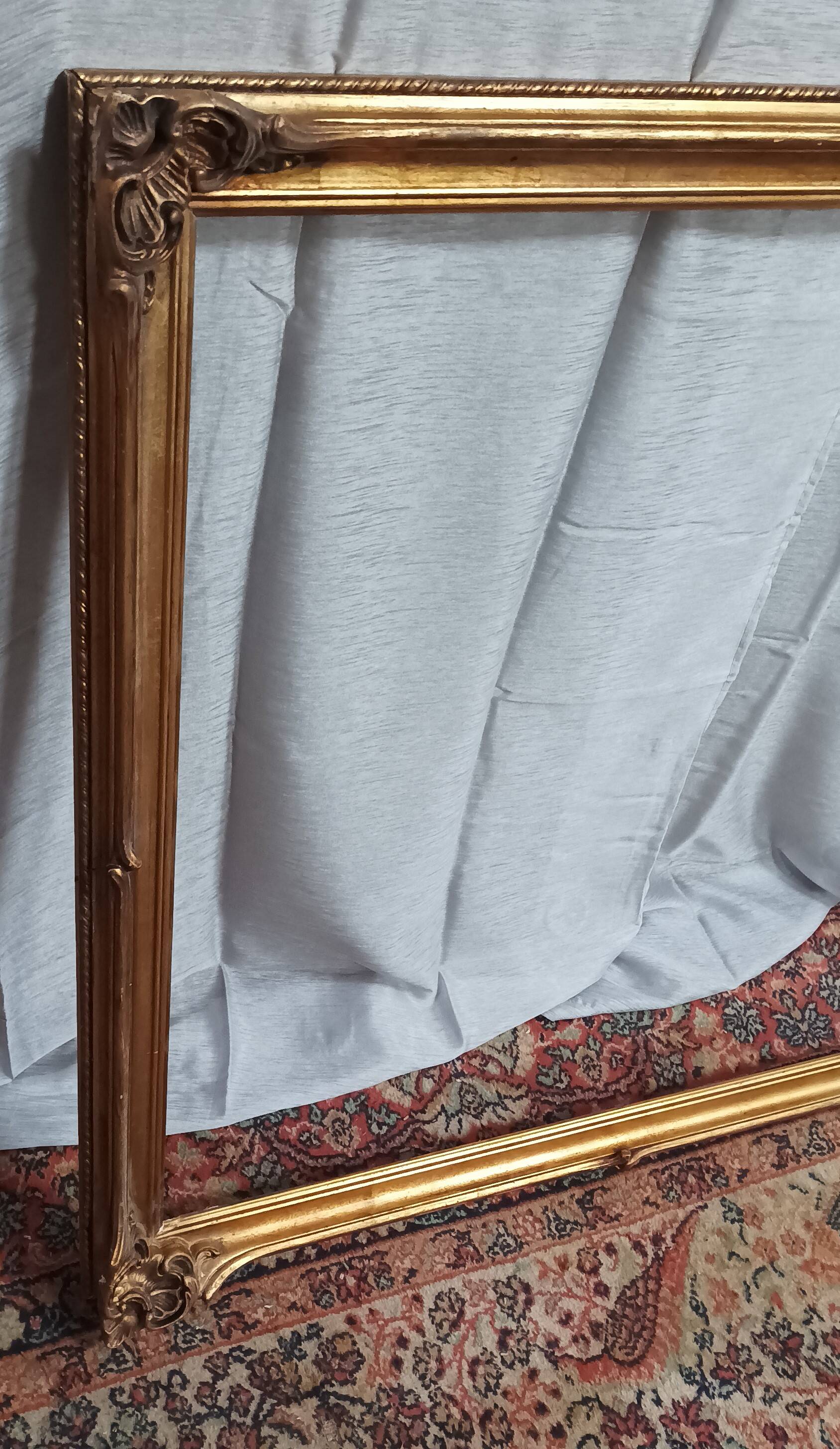 Old frame in wood and gilded stucco