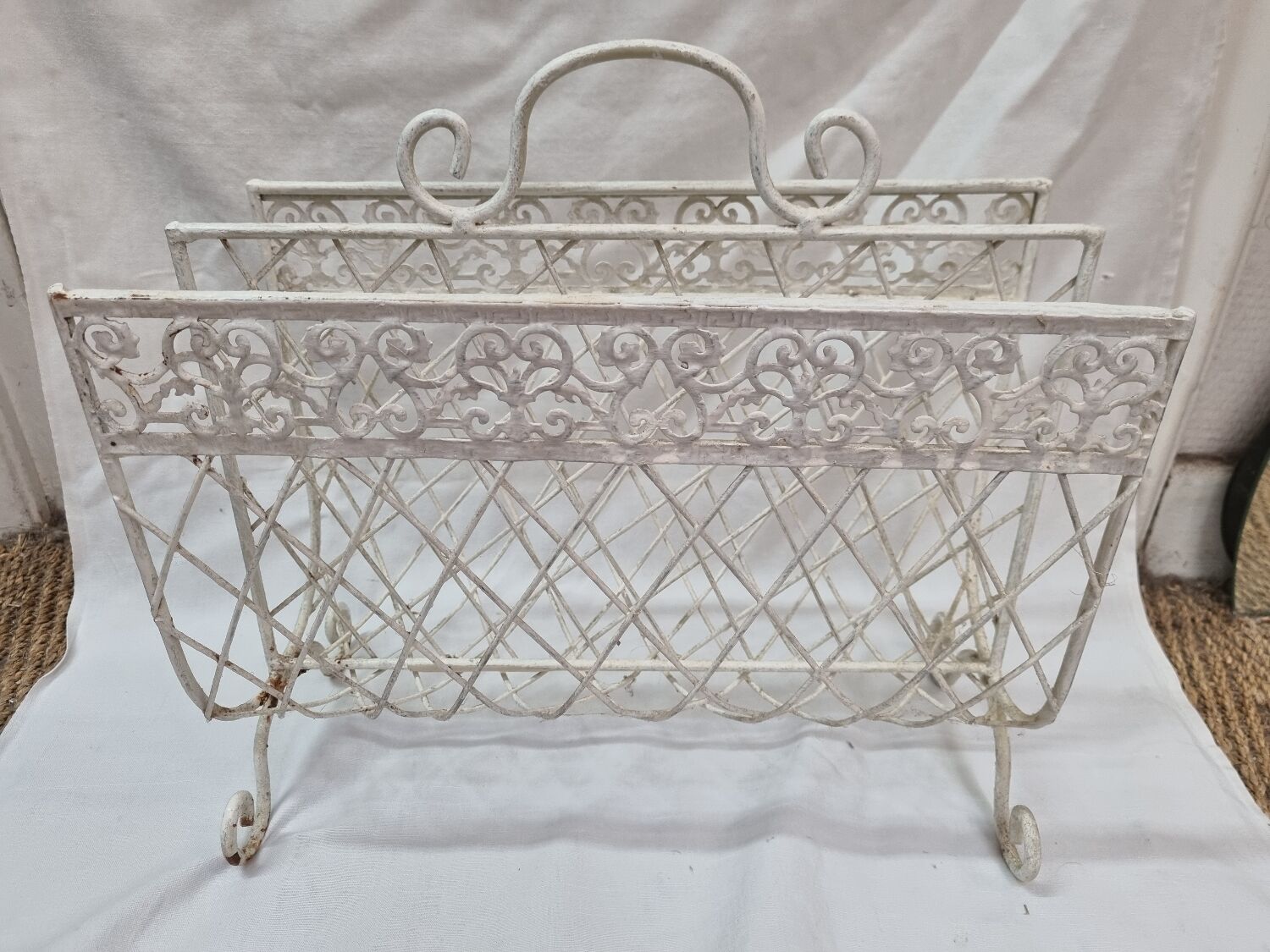 White wrought iron magazine holder