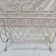 White wrought iron magazine holder