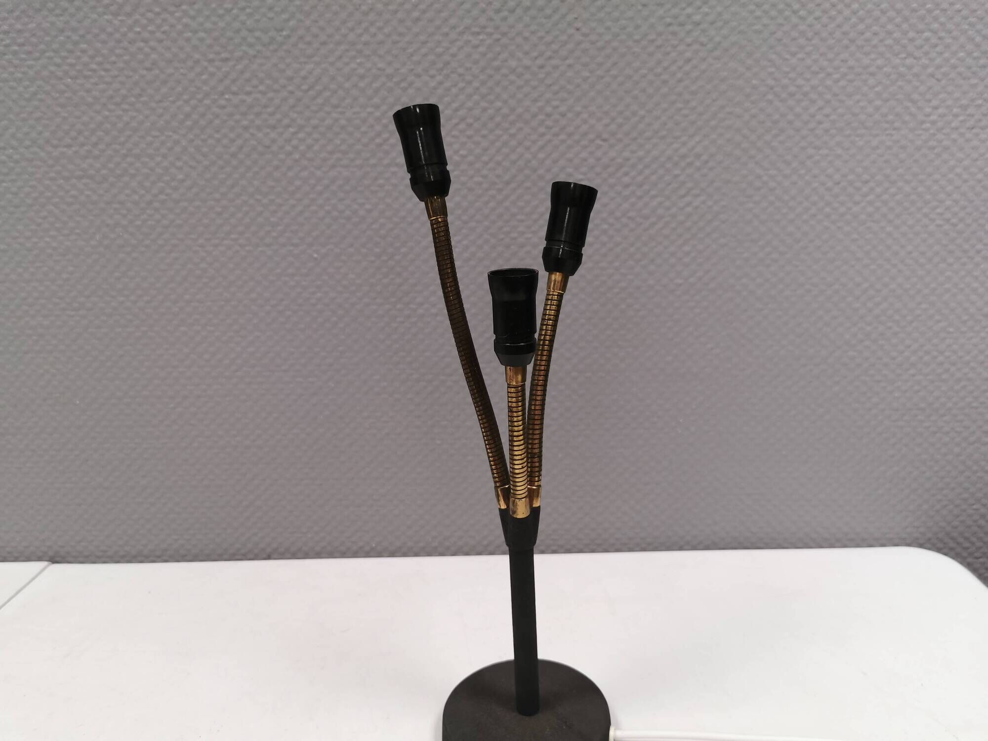 Old cast iron table lamp with brass bend and 3 light sources