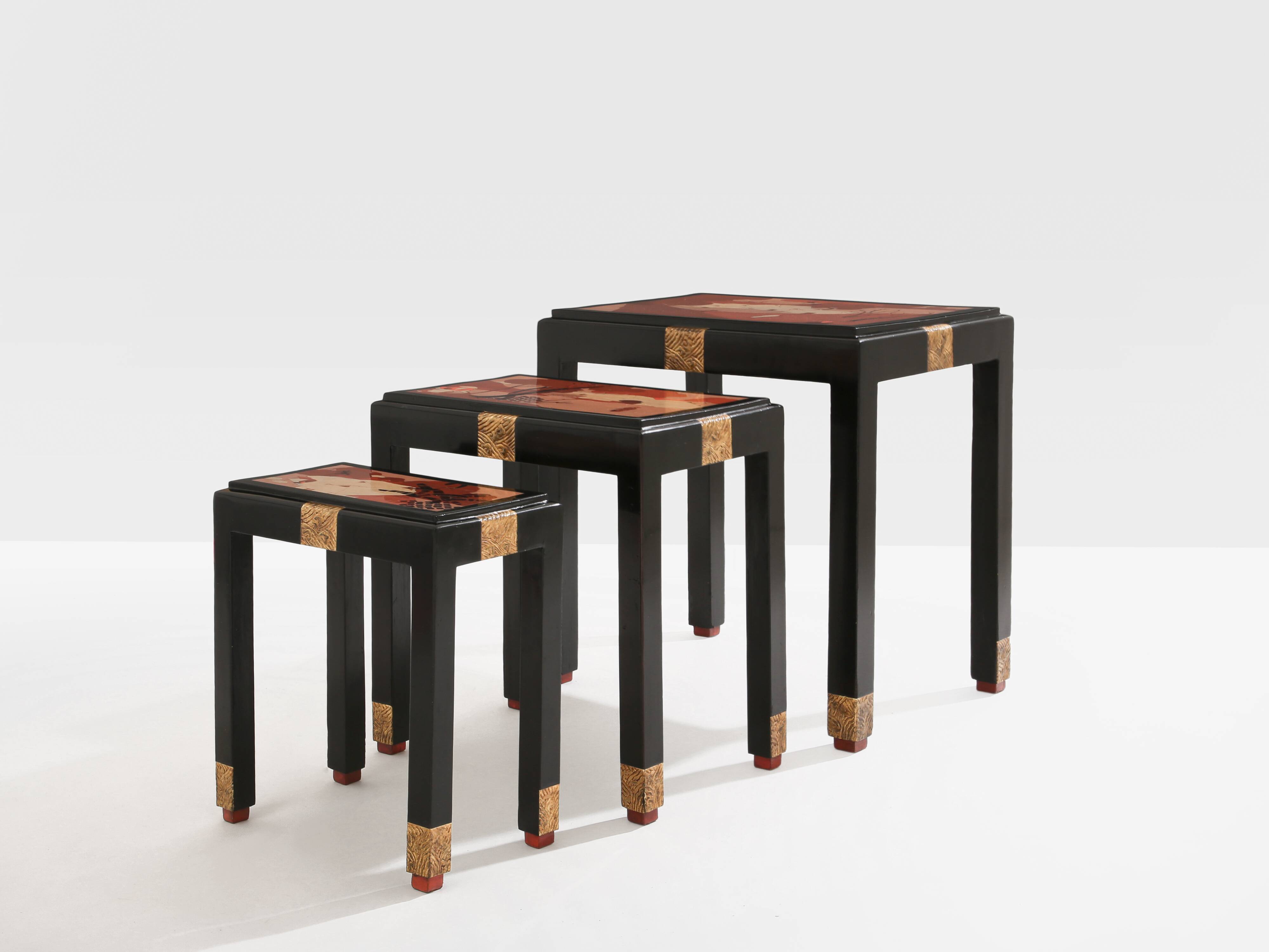 Set of three nesting tables with Asian decor, blackened wood, circa 1920.
