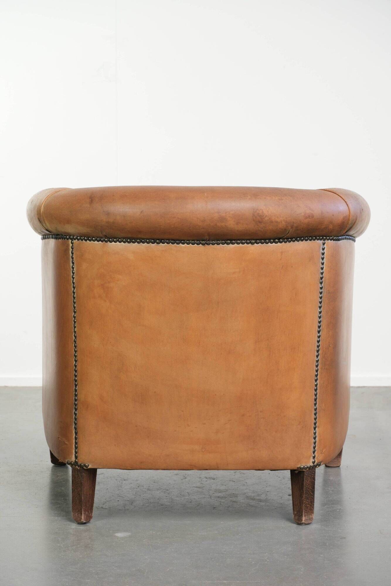 Vintage sheepskin club armchair in a beautiful light cognac colour