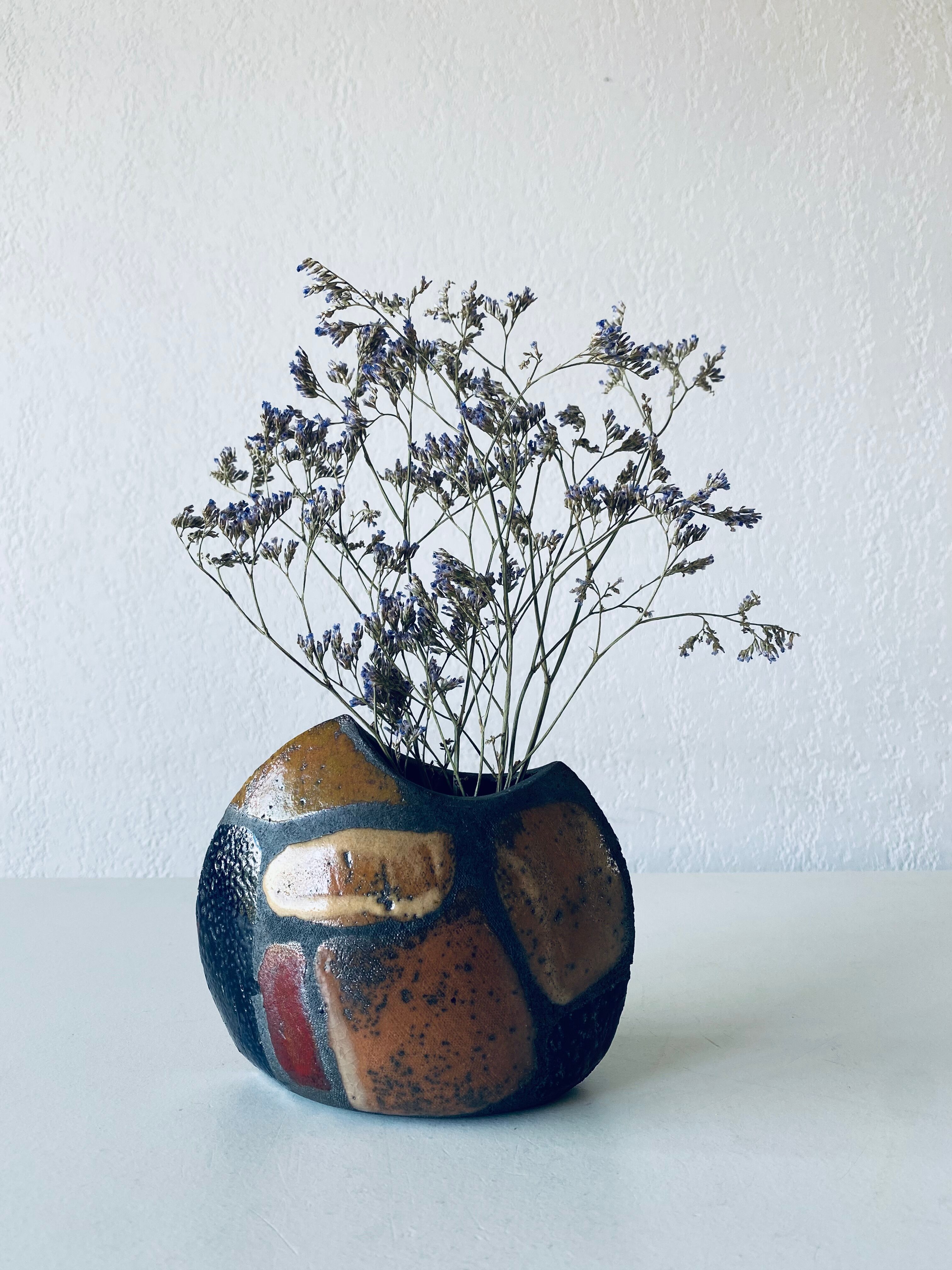 Enamelled ceramic lens vase