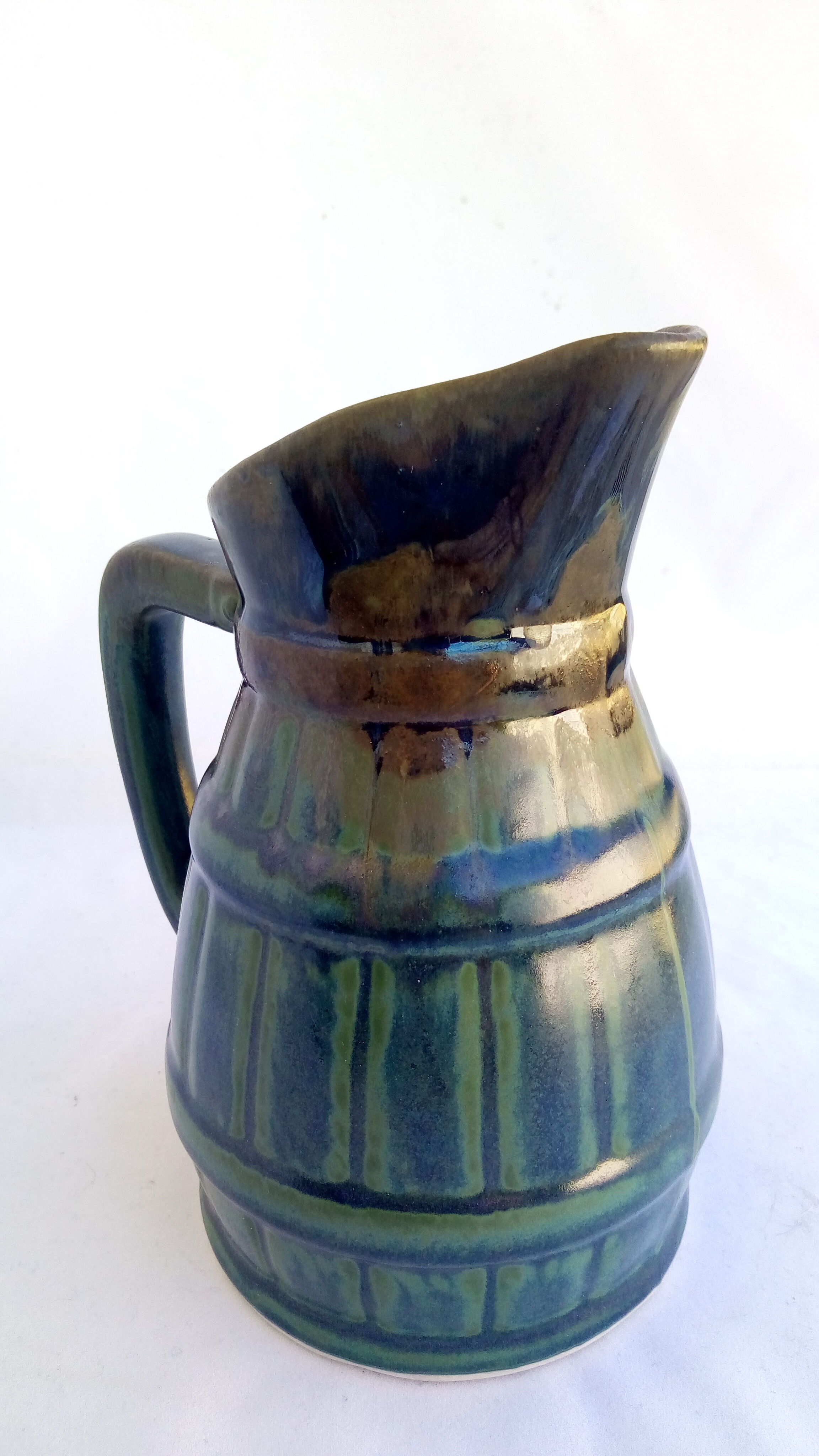 Black, blue, green pitcher