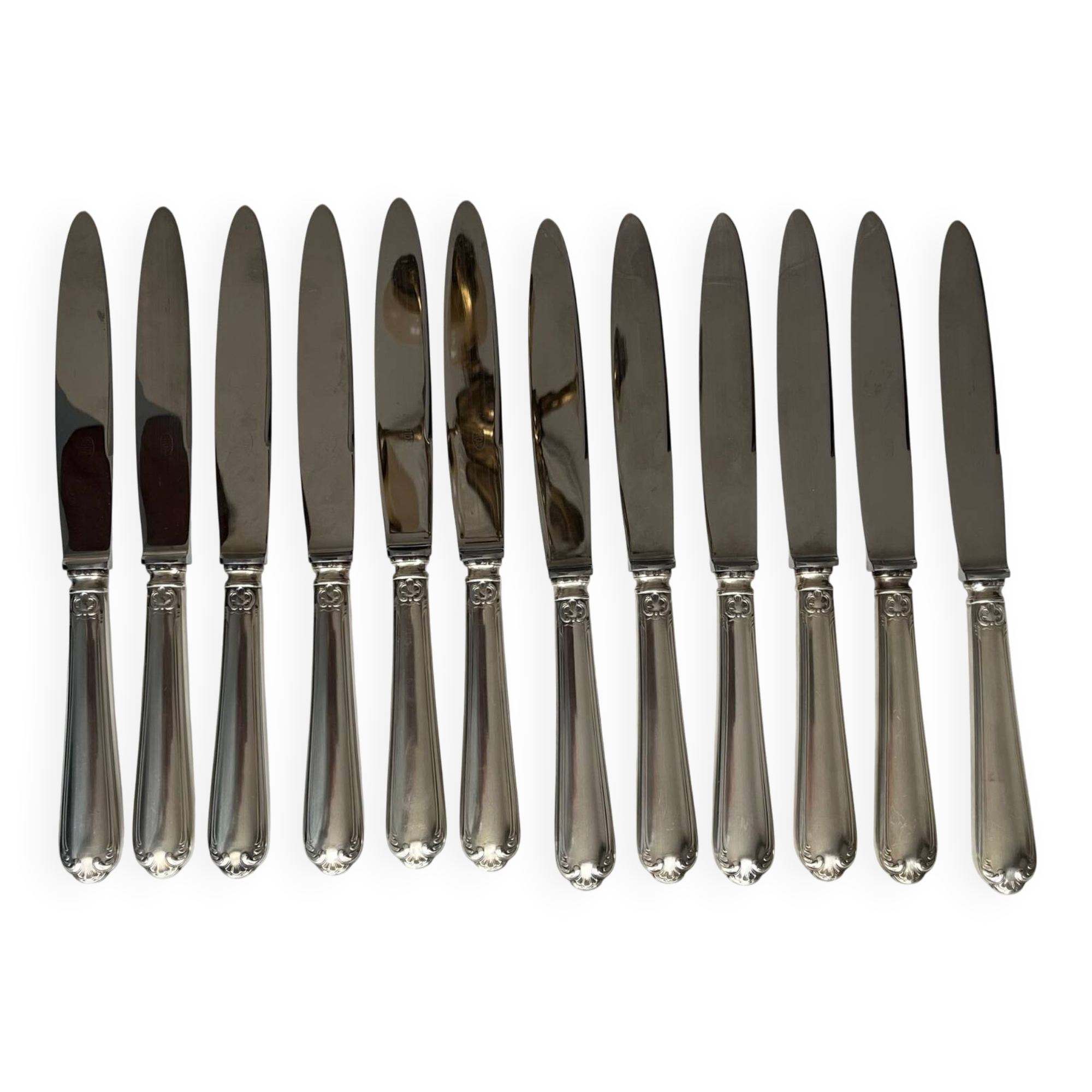 12 silver-plated metal knives