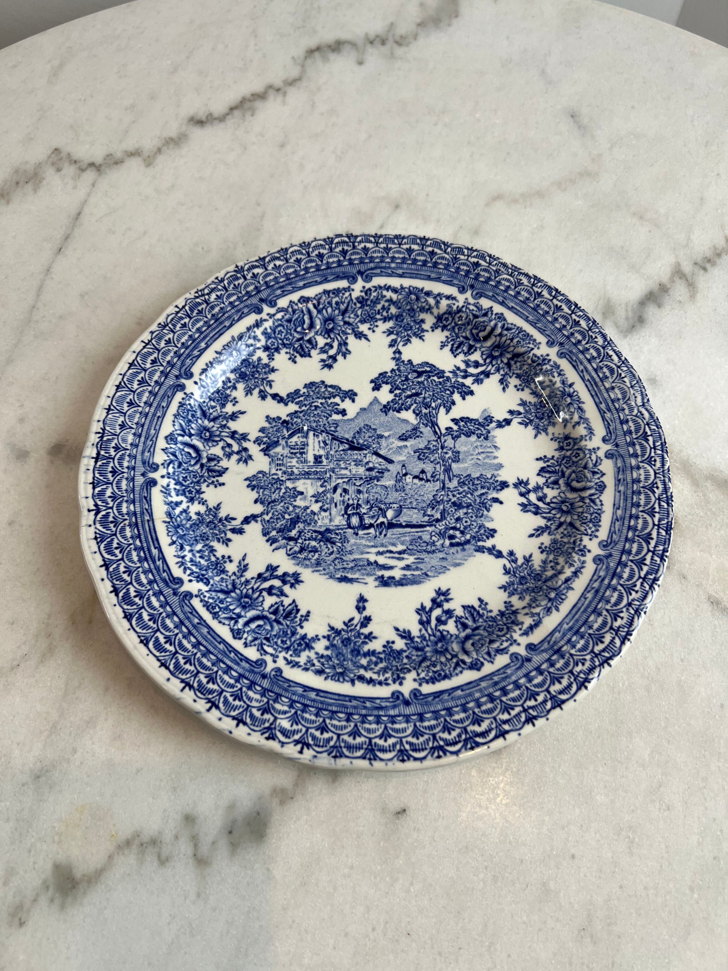 Set of four flat plates from English earthenware.