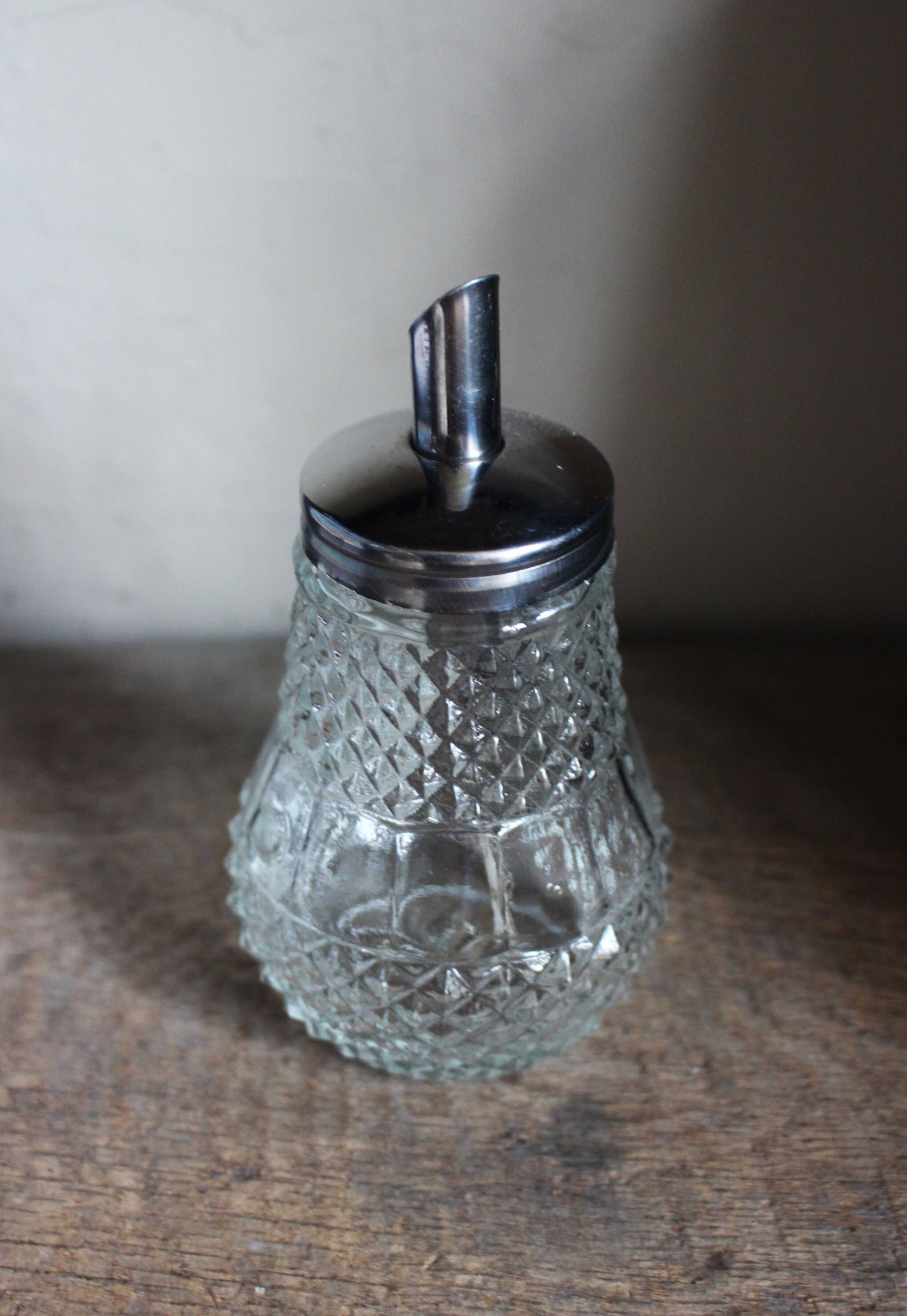 Vintage sugar bowl in chiseled glass Metal pourer
