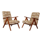 Pair of vintage lounge chairs in brown jacquard fabric and wood.