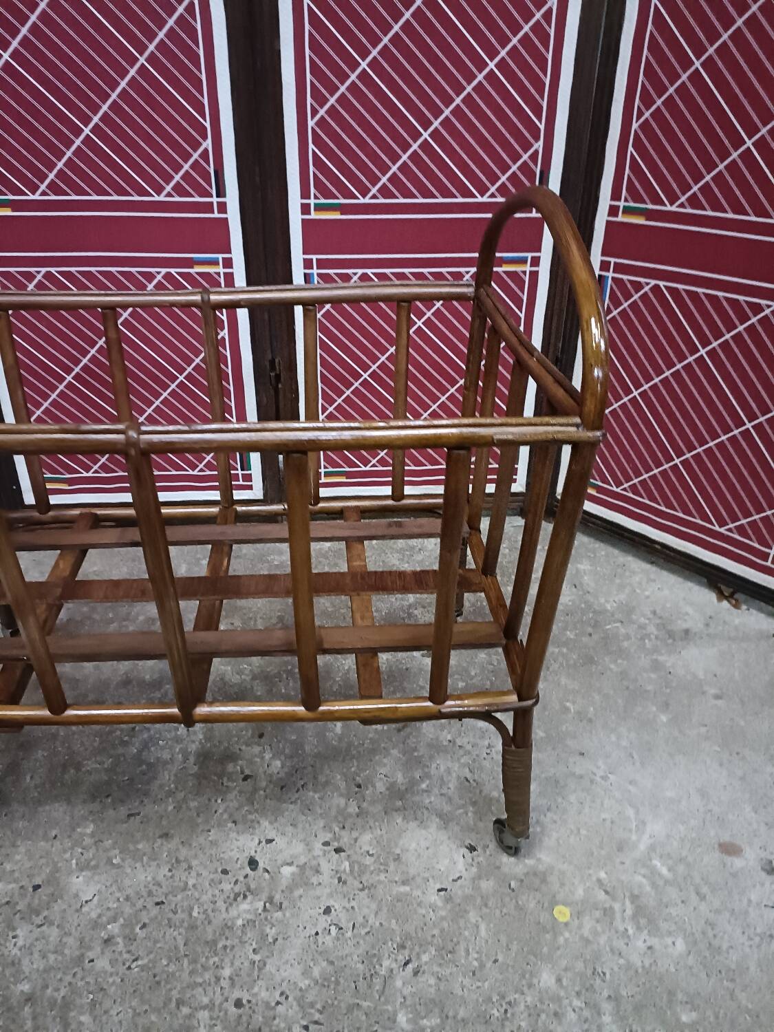 Old small bed or cradle for baby in vintage rattan