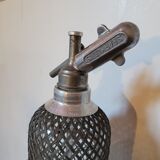 Old glass and metal siphon