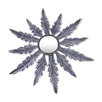 Metal mirror with foliage decoration