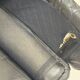 Vintage black leather lounge chair — low postmodern club chair from the space age.