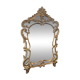 Mirror with carved and gilded wooden frame, 18th century, with scrollwork decoration.