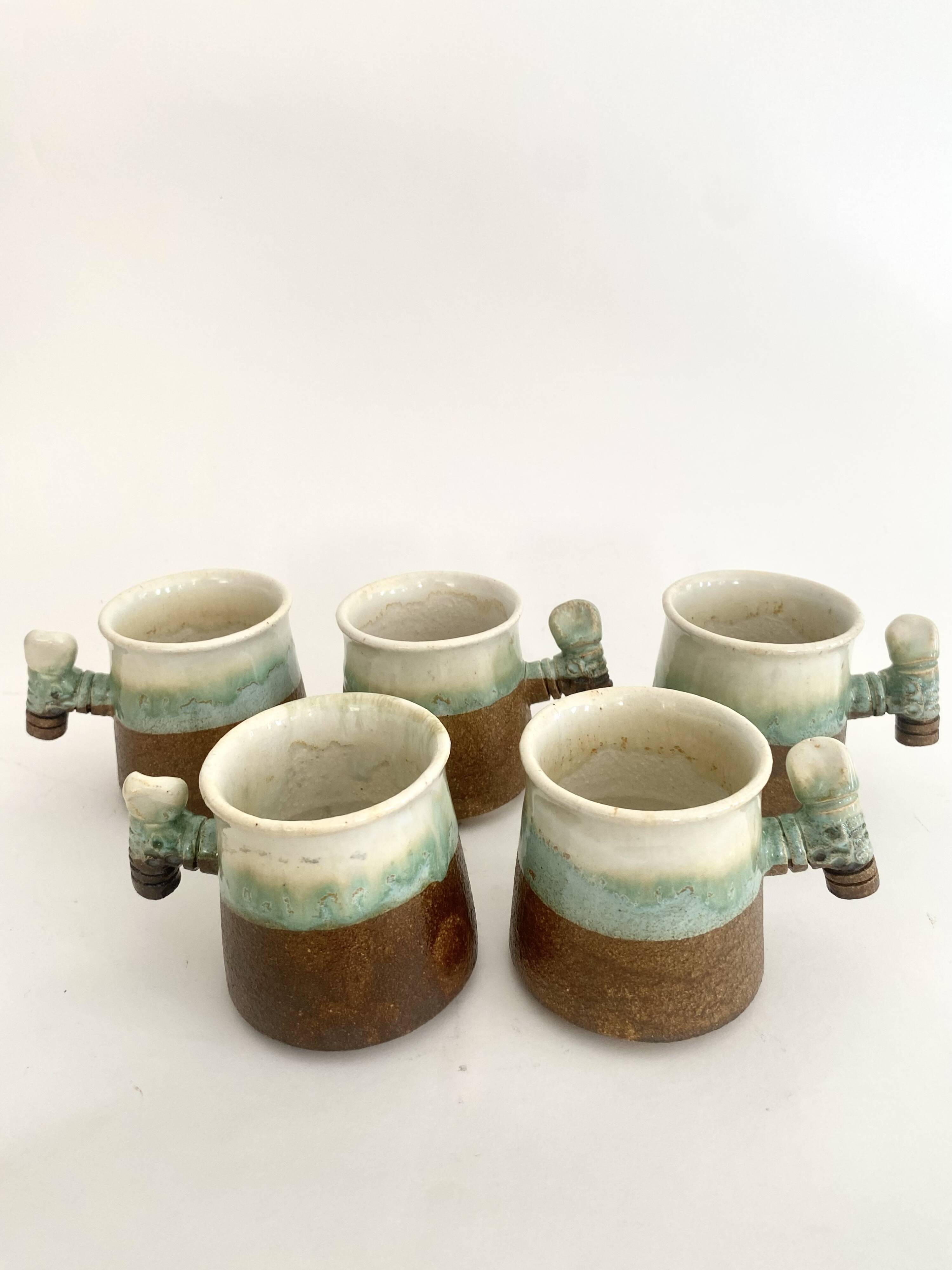 5 glazed and scarified ceramic cups