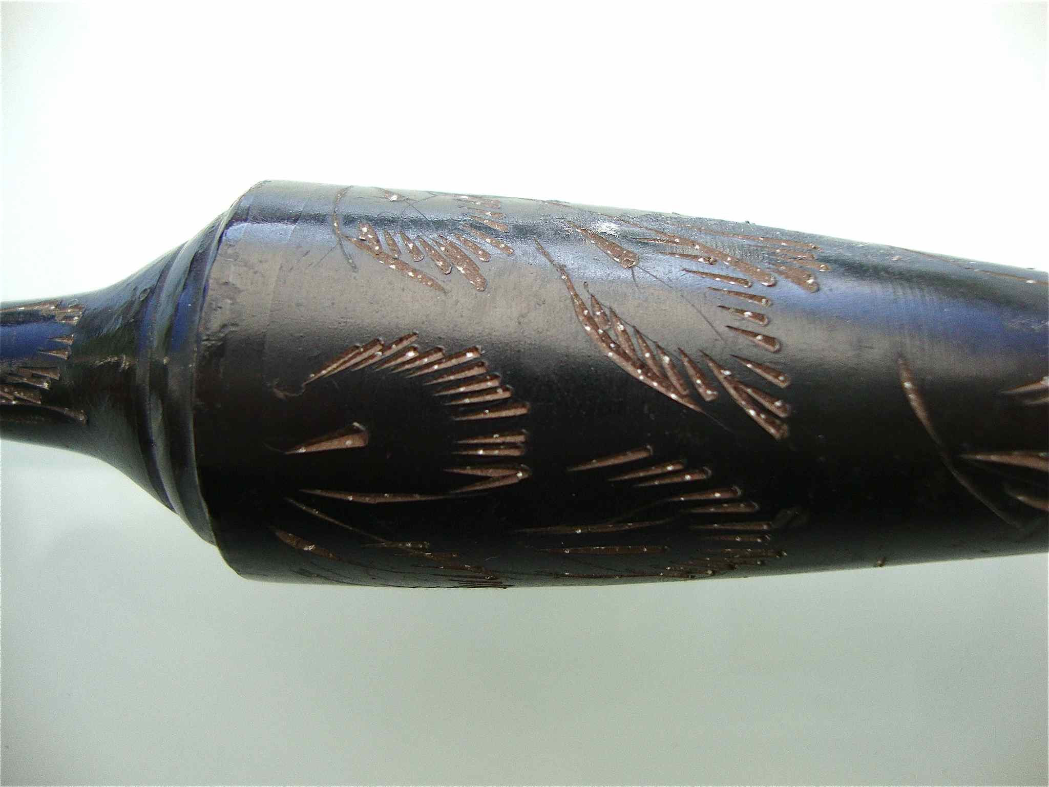 Stylized vase in engraved metal