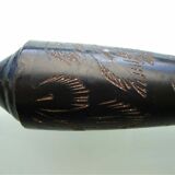 Stylized vase in engraved metal